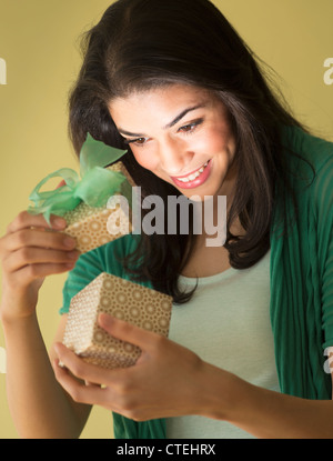 Young woman opening gift box Stock Photo