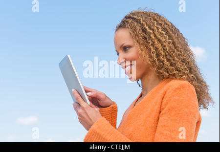 USA, New Jersey, Jersey City, Mature woman using tablet pc Stock Photo