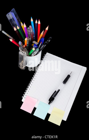 School education supplies items isolated on a black background Stock Photo