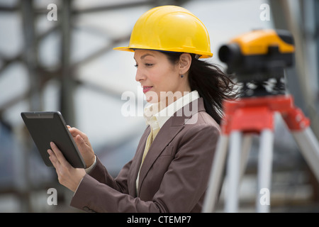 USA, New Jersey, Jersey City, Architect using digital tablet in construction site Stock Photo