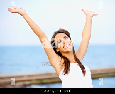 Portrait of a carefree woman enjoying the outdoors Stock Photo