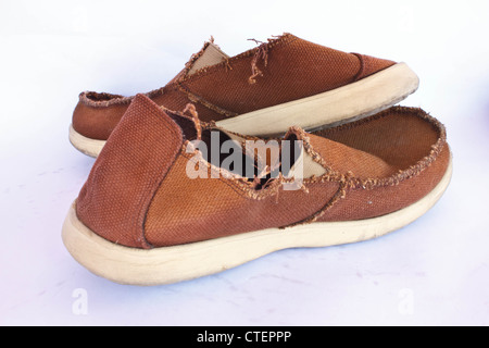 Stock Photo - Battered old sneakers, isolated on white. These have definitely seen better days! Stock Photo