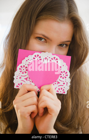 USA, New Jersey, Jersey City, Woman holding valentine card Stock Photo