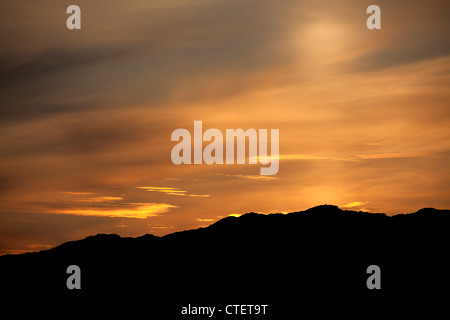 Isle of Harris, Scotland. Silhouetted sunset view over Harris’s hills and mountains. Stock Photo