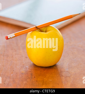 Close up of pencil on apple, studio shot Stock Photo
