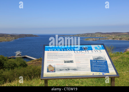 Local wartime arctic convoys information board by NATO refuelling depot on Loch Ewe on Scottish coast Aultbea Wester Ross Scotland UK Britain Stock Photo