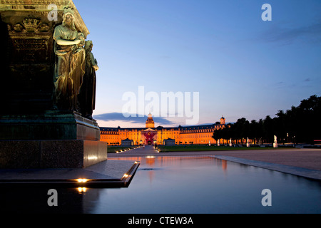 fountain in front of the illuminated Karlsruhe Palace, Karlsruhe, Baden-Württemberg, Germany Stock Photo