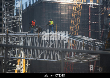 USA, New York, New York City, Manhattan, Workers on construction site Stock Photo