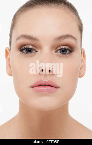 Portrait of young woman looking straight at camera Stock Photo