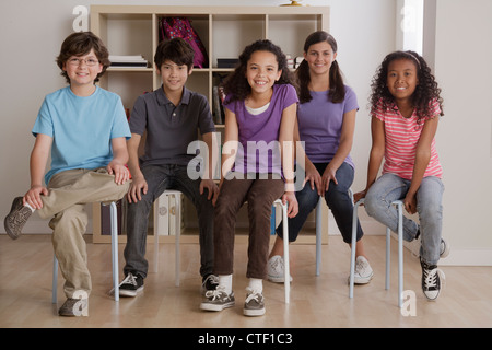 USA, California, Los Angeles, portrait of smiling pupils sitting in classroom Stock Photo