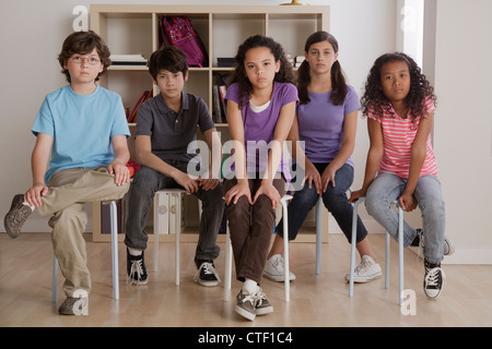 USA, California, Los Angeles, portrait of serious pupils sitting in classroom Stock Photo