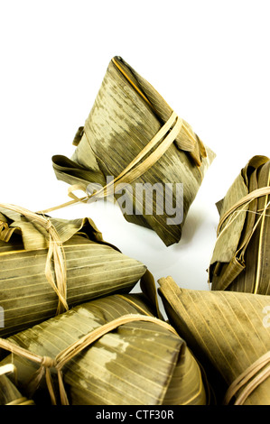 An isolated Rice Dumpling among the dumplings. Isolated on white. Stock Photo