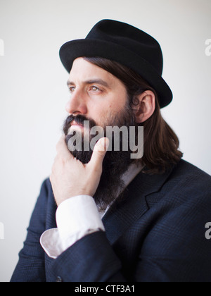 Portrait of contemplative bearded young man Stock Photo