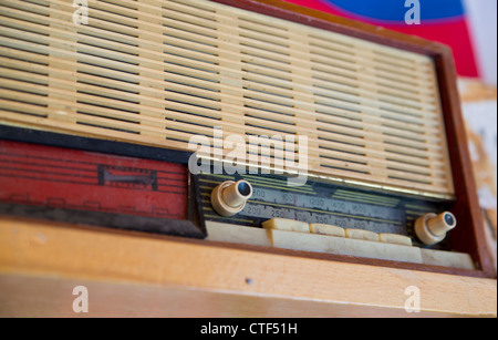 Old fashioned retro radio dusted on home shelf Stock Photo