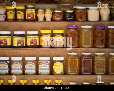 Pots of Cypriot Honey and preserves on shelving Stock Photo