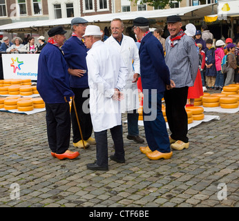 Cheese market traders wearing clogs Gouda, Netherlands Stock Photo