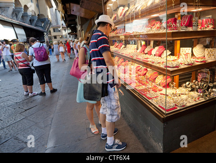 Tourists look at jewelry stores on Ponte Vecchio, Florence, Italy Stock Photo