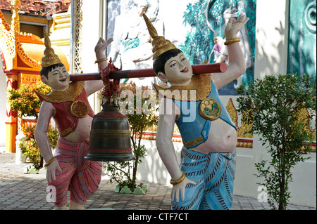 Laughing bell bearers, Dhammikarama Burmese Temple, Georgetown, Penang, Malaysia. Stock Photo
