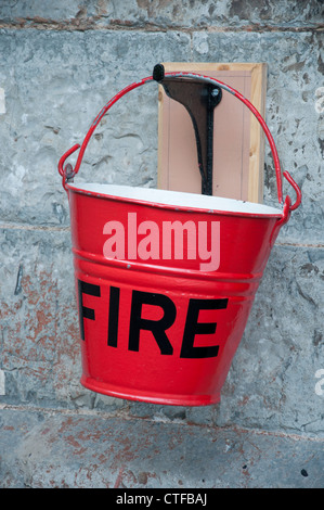 Old fire bucket at Watchet station, West Somerset Railway. UK Stock Photo