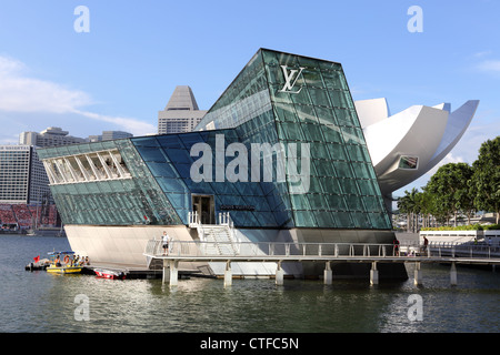 Louis Vuitton island Maison shop at the Marina Bay Sands in Singapore. Stock Photo