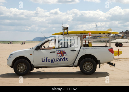 RNLI Lifeguards surveying the coast from their van Stock Photo