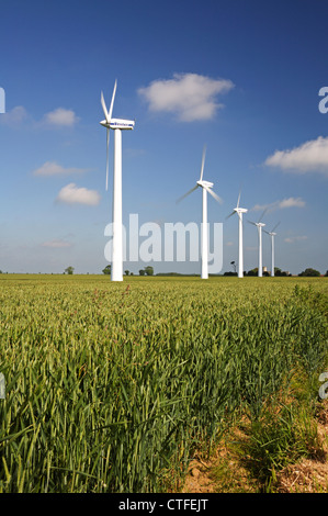 A row of wind turbines on farmland at West Somerton, Norfolk, England, United Kingdom. Stock Photo