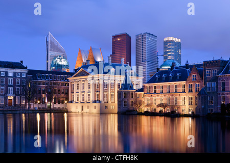 Netherlands, Group of buildings called Binnenhof, center of Dutch politics. In the middle museum called Mauritshuis. Dusk.