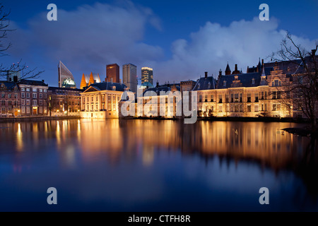 Netherlands, Group of buildings called Binnenhof, center of Dutch politics. In the middle museum called Mauritshuis. Dusk.