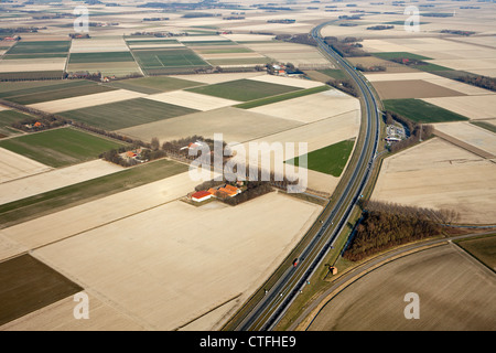 The Netherlands, Nagele, Farms and farmland in Flevopolder. Highway A6. Aerial. Stock Photo