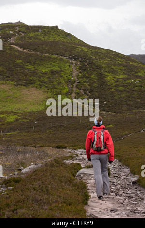 A hiker walking the trail over Simonside Hills near Rothbury on an ...