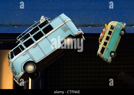 Retro VW Camper van ornaments hanging outside a shop in Portobello Road. London Stock Photo