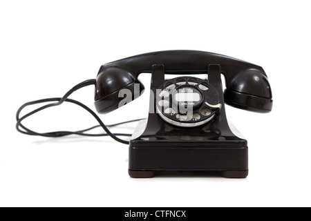 A vintage, black 1940's telephone on a white background Stock Photo