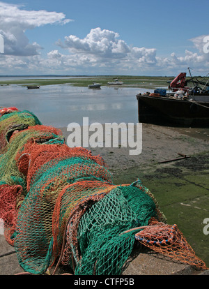 Fishing nets drying in the sun on the riverbank of the Thames Estuary, at Old Leigh, in Essex Stock Photo