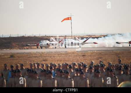 Hazerim AFB, Israel. Israeli Air Force (IAF) Aerobatic team takes off. Flight cadets stand on parade in the foreground. Stock Photo