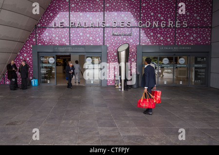 France, People entering the Le Palais des Congrès de Paris convention center, built by  Guillaume Gillet, near Porte Mailot. Stock Photo