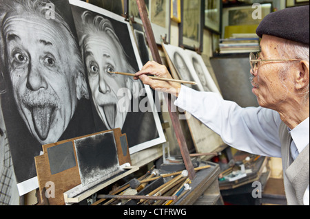 A painter copying a picture of Albert Einstein Stock Photo