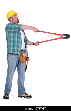 Man using bolt cutter Stock Photo