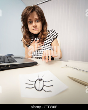 Woman scared cockroach drawn on paper Stock Photo
