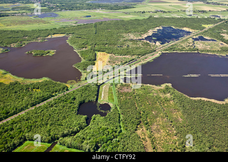 The Netherlands, Naarden, Lake called Naardermeer. Aerial. Train passing. Stock Photo
