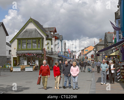 People tourists visitors walking along Main Street in summer Keswick Cumbria England UK United Kingdom GB Great Britain Stock Photo