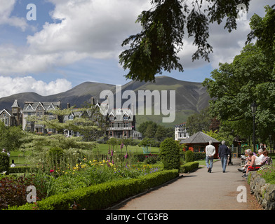 People tourists visitors walking in Hope Park and Gardens in summer Keswick Lake District National Park Cumbria England UK United Kingdom Britain Stock Photo