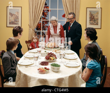 1970s THREE GENERATION FAMILY HAVING THANKSGIVING DINNER Stock Photo