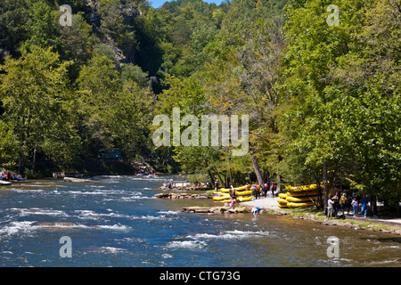 Whitewater rafters collect on bank of river at the Nantahala Outdoor Center near Bryson City, North Carolina Stock Photo