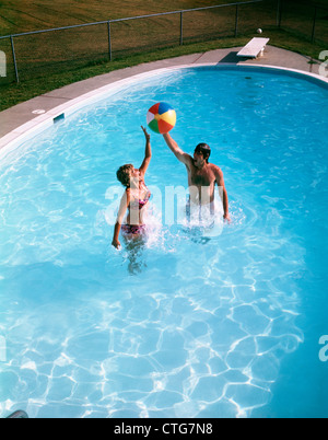 Woman jumping for joy in backyard Stock Photo - Alamy