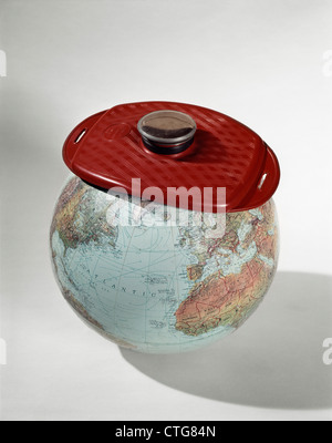 1960s EARTH GLOBE WEARING ICE PACK RED HOT-WATER BOTTLE SICK AILING WORLD Stock Photo