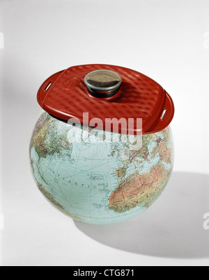 1960s EARTH GLOBE WEARING ICE PACK RED HOT-WATER BOTTLE SICK AILING WORLD Stock Photo
