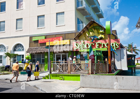 Tourists going to Senor Frog's souvenir shop in Nassau, Bahamas Stock Photo