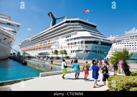 Cruise ship passengers going to and from cruise ships at dock in Nassau, Bahamas Stock Photo