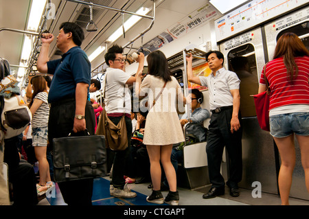 Passengers on subway train, Seoul, Korea Stock Photo