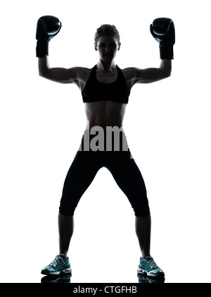 one caucasian woman exercising boxe fitness workout posture in silhouette studio isolated on white background Stock Photo